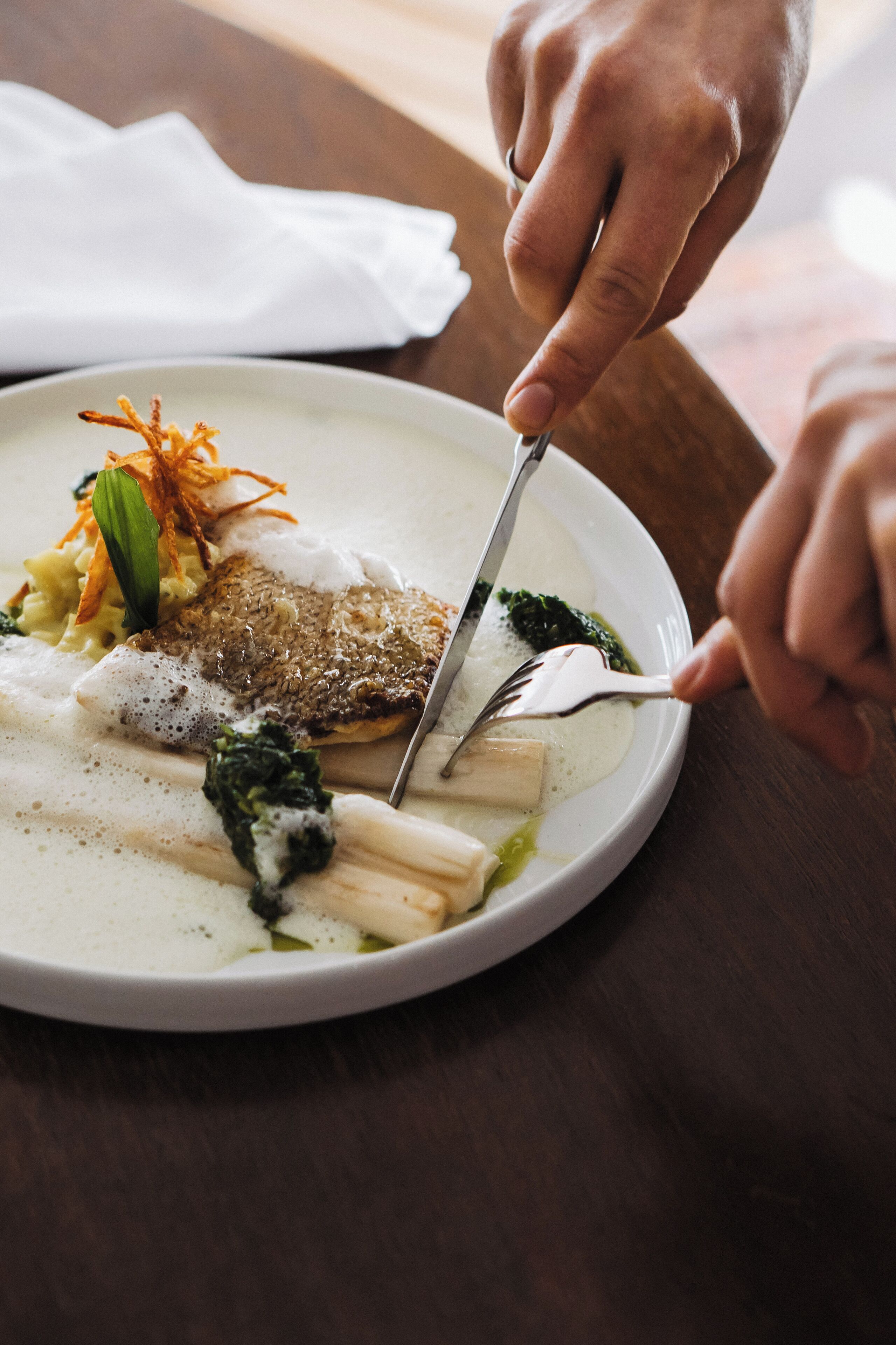 A plate of food with a fork and knife.