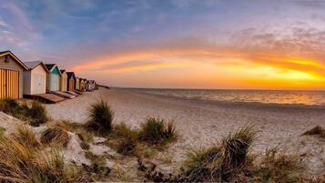 On the beach, sun-loungers, beach towels