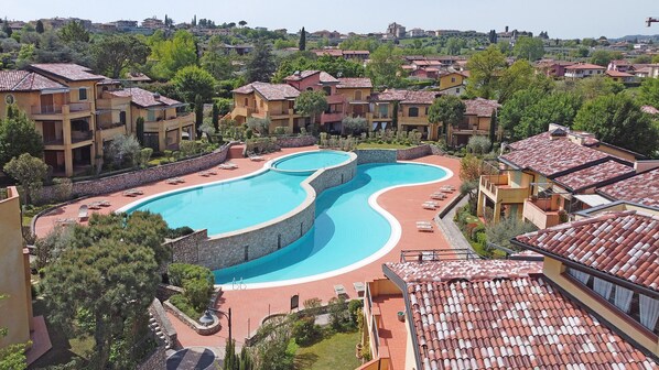 Relax by the resort's large, winding pool surrounded by lounge areas with sun loungers.