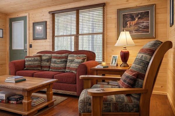 Family room, hardwood floors and pine walls through.