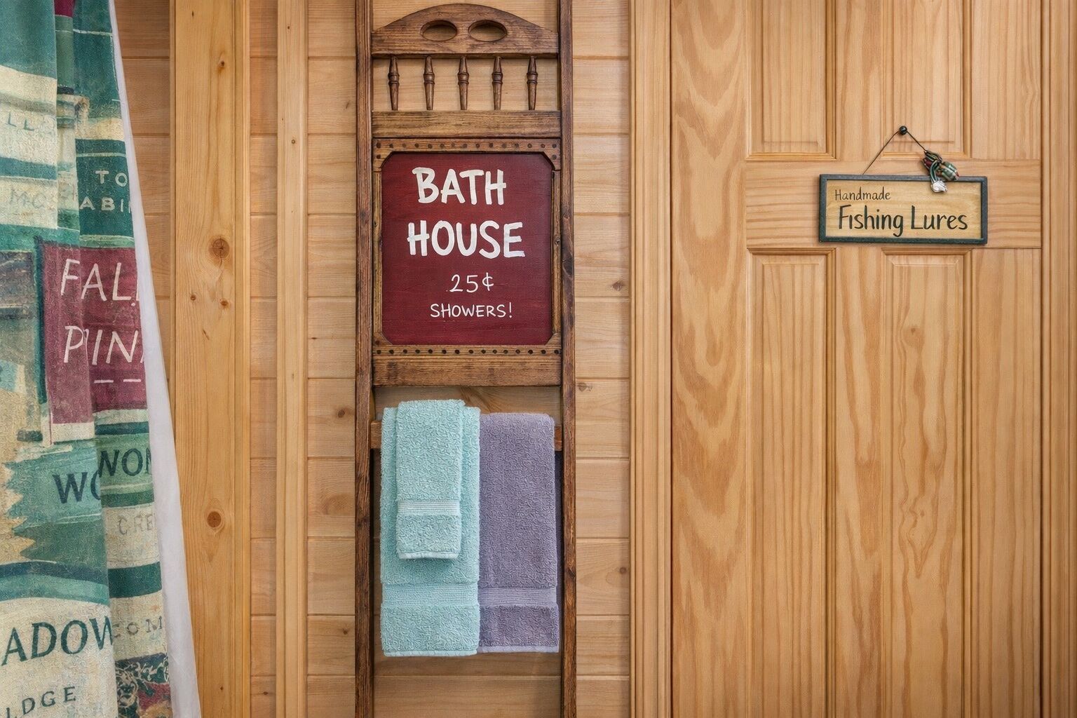 A wooden bathhouse with a sign indicating 25¢ showers.
