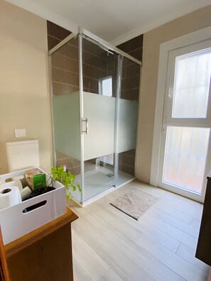 Shower, hair dryer, towels, soap