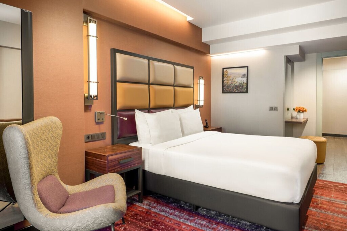 Habitación familiar, vistas al mar | Ropa de cama de alta calidad y minibar