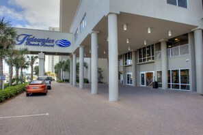 Stunning resort entrance with a modern design and beautifully landscaped surroundings.