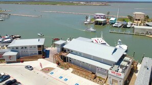 Marina - `Enter Shark Attacks and soak in the coastal charm, the perfect backdrop for a refreshing retreat. With a spacious open floor plan, it`s ideal for family gatherings and lasting memories.` (Port Aransas)