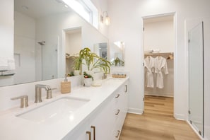 Shower, hair dryer, towels, toilet paper
