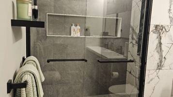 Shower, hair dryer, towels, soap