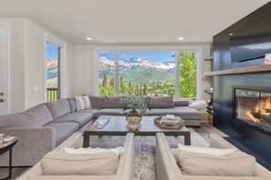 TV, fireplace - Sleek Lorian Condo by InvitedHome | Walk to Ski, Gym, Unobstructed Views (Mountain Village)