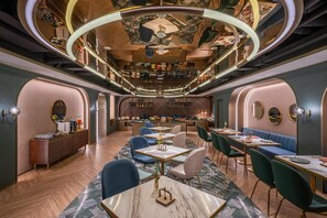 A modern interior with a bar area, seating, and a herringbone floor pattern. - Manxin Hotel Yantai Binhai Plaza (Yantai)