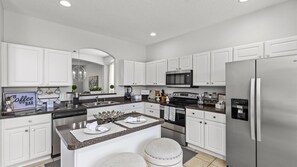 Fridge, microwave, oven, stovetop - Treasure Hunt Retreat Villa at Allevo Homes (Kissimmee)
