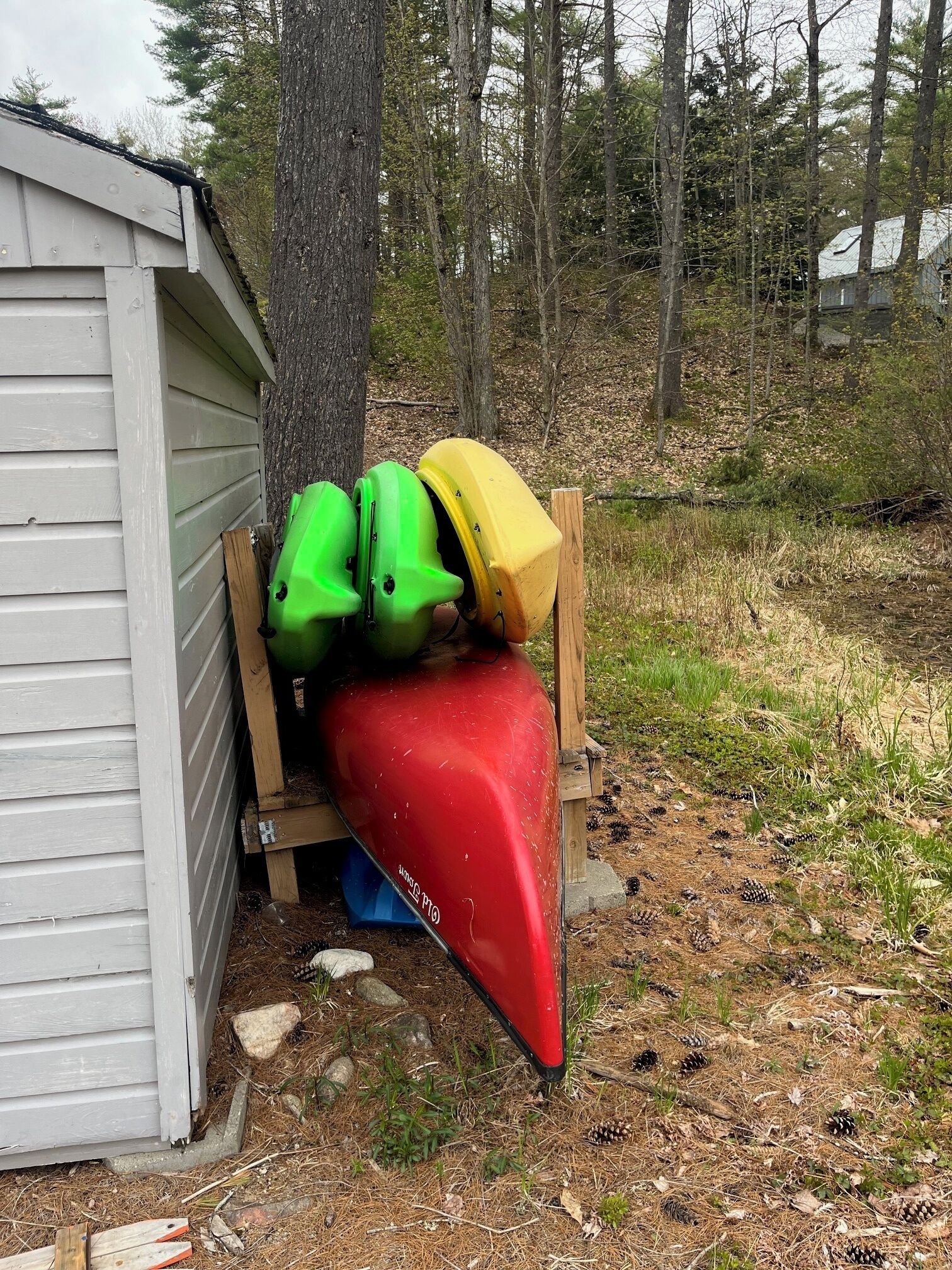 A shed with kayaks stored inside.