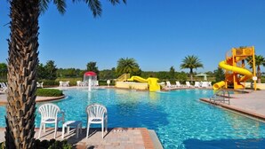 A swimming pool with water slides and lounge chairs. - Gorgeous 6Bd Pool Hm Providence-2256CA (Davenport)