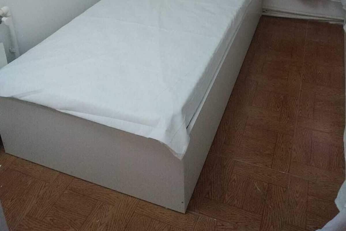 Premium bedding, desk, laptop workspace, soundproofing
