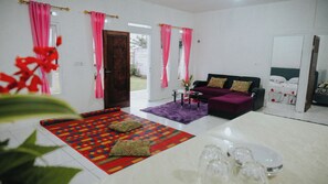 Family Villa | Living area | 27-inch LCD TV with cable channels, fireplace, MP3 dock - homestay sembiring dua (Megamendung)