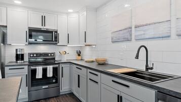 Fridge, coffee/tea maker, cookware/dishes/utensils