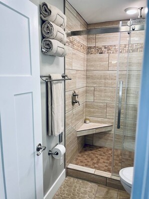 Shower, hair dryer, towels, soap
