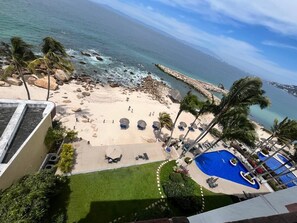 On the beach, sun loungers - Family-sized Beachfront Penthouse with a Tropical vibe (Puerto Vallarta)