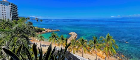 On the beach, sun-loungers