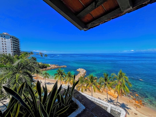 Beachfront Penthouse with Los Arcos Views, Private Terrace & Beach Access