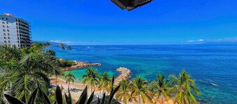 Beachfront Penthouse with Los Arcos Views, Private Terrace & Beach Access