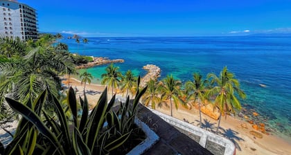 Beachfront Penthouse with Los Arcos Views, Private Terrace & Beach Access