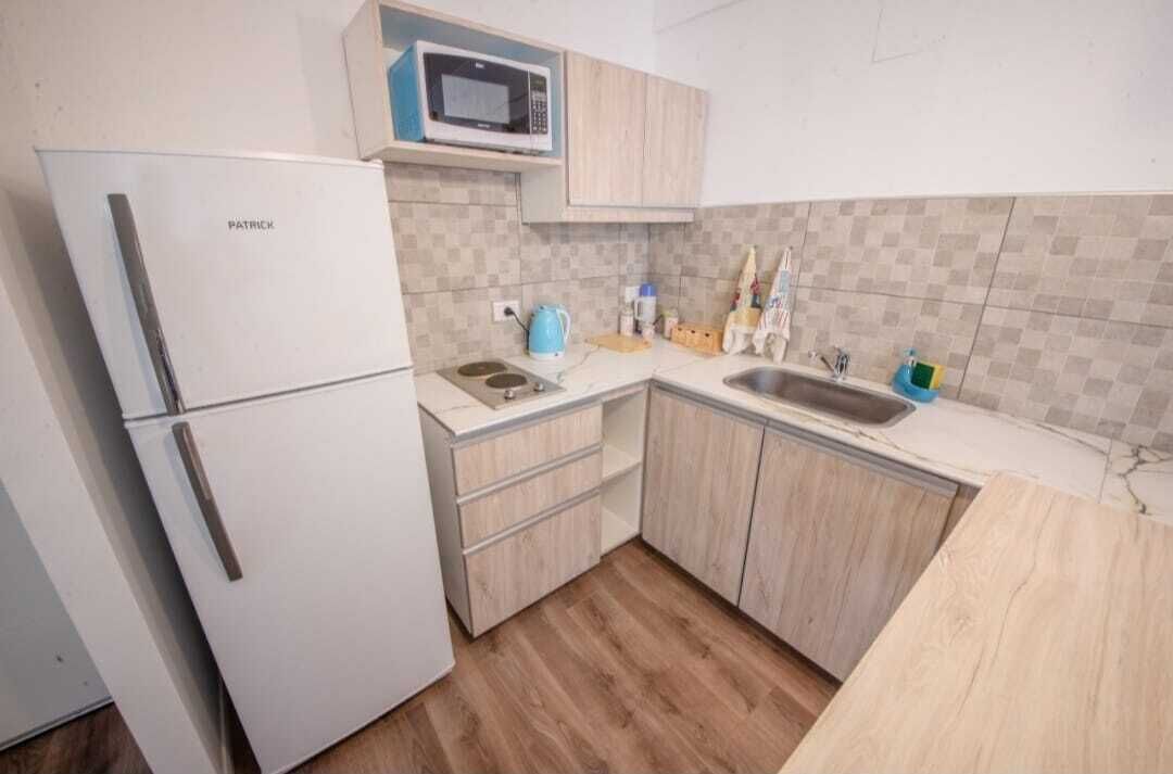 Standard Apartment | Private kitchen | Full-sized fridge, microwave, toaster, cookware/dishes/utensils