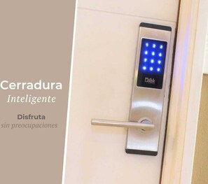 A door with an intelligent lock system featuring a keypad and a full lock indicator.