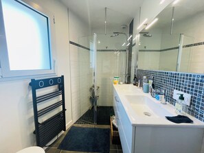Shower, hair dryer, towels, toilet paper