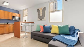 Comfort Apartment | Living area | 50-inch Smart TV with digital channels