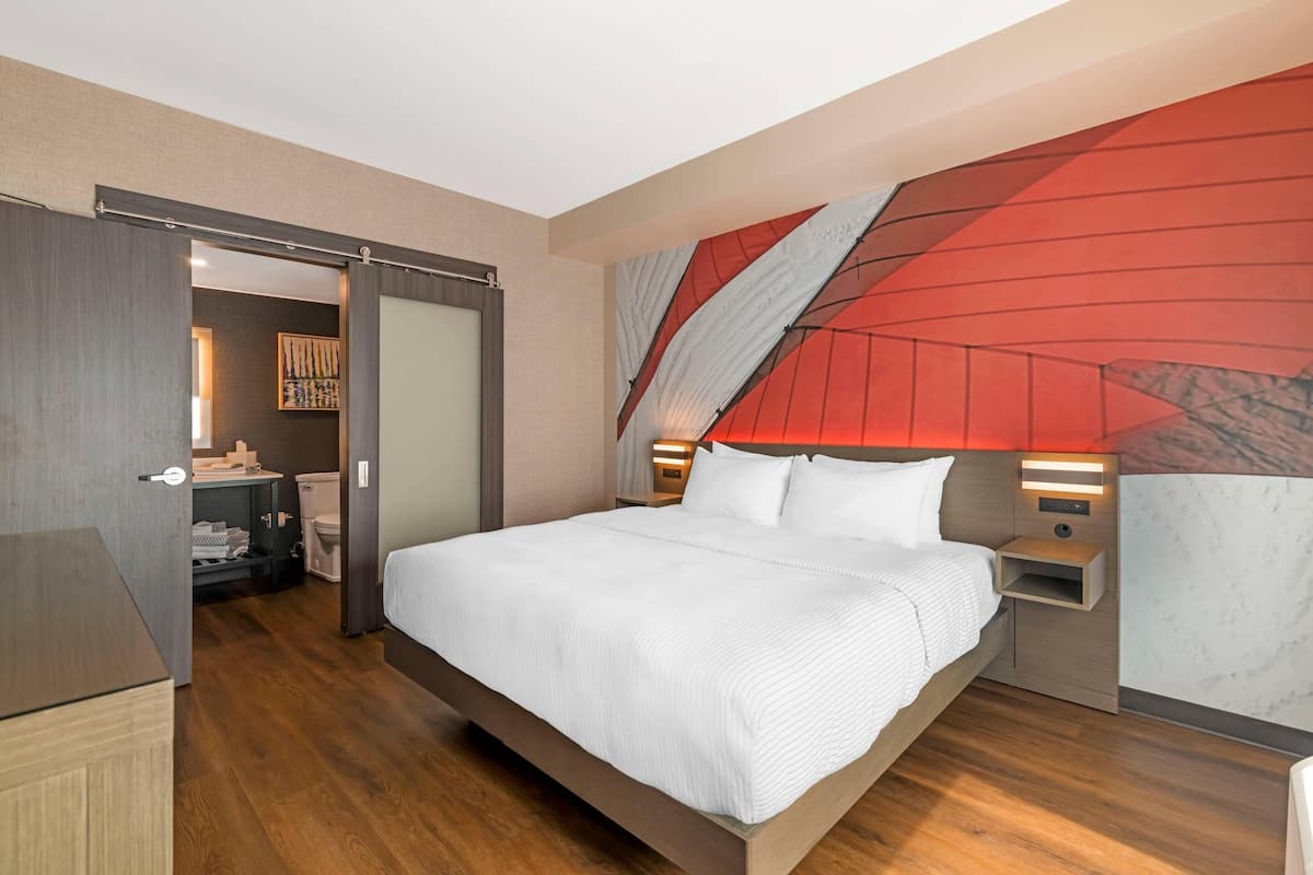 Suite, 1 King Bed, Non Smoking | Laptop workspace, iron/ironing board, free WiFi, bed sheets