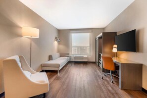 Suite, 1 King Bed, Non Smoking (Accesible) | Laptop workspace, iron/ironing board, free WiFi, bed sheets