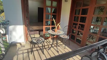 Deluxe Room, Balcony, Garden View | Desk, free WiFi