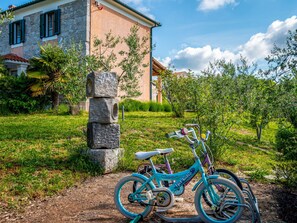 Experience the serene atmosphere of this Mediterranean-style retreat, surrounded by lush greenery and rustic charm.