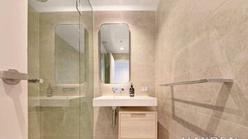 Shower, hair dryer, towels, soap