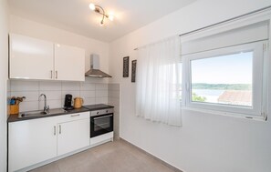 Fridge, oven, coffee/tea maker, cookware/dishes/utensils