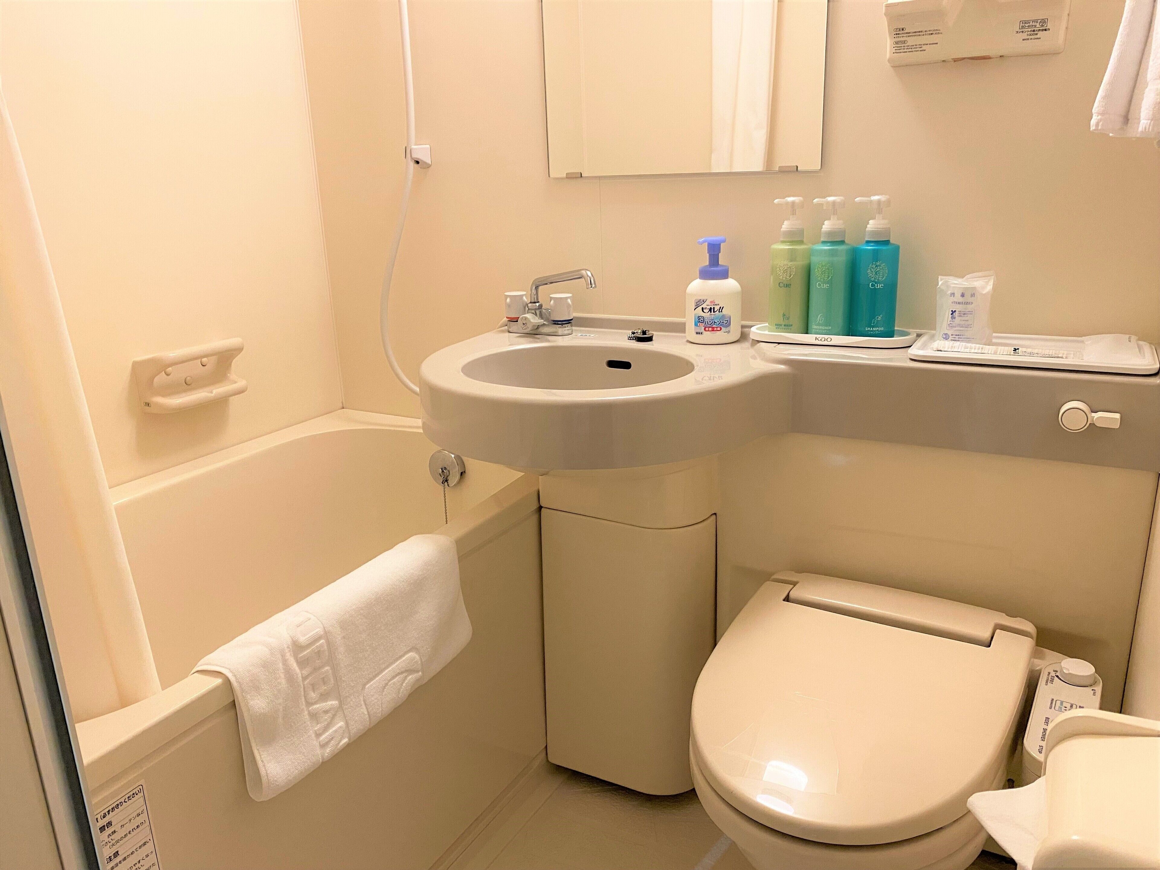 Combined shower/tub, hair dryer, slippers, towels