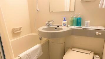 Combined shower/tub, hair dryer, slippers, towels