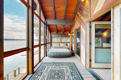 Charming lakefront home & cottage with a deck, hot tub, & washer/dryer