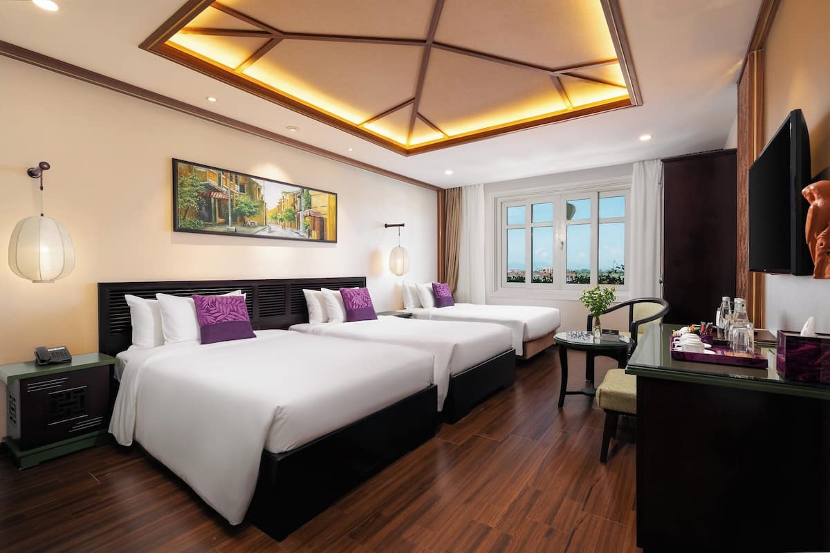 Family Triple Room | Minibar, in-room safe, desk, soundproofing