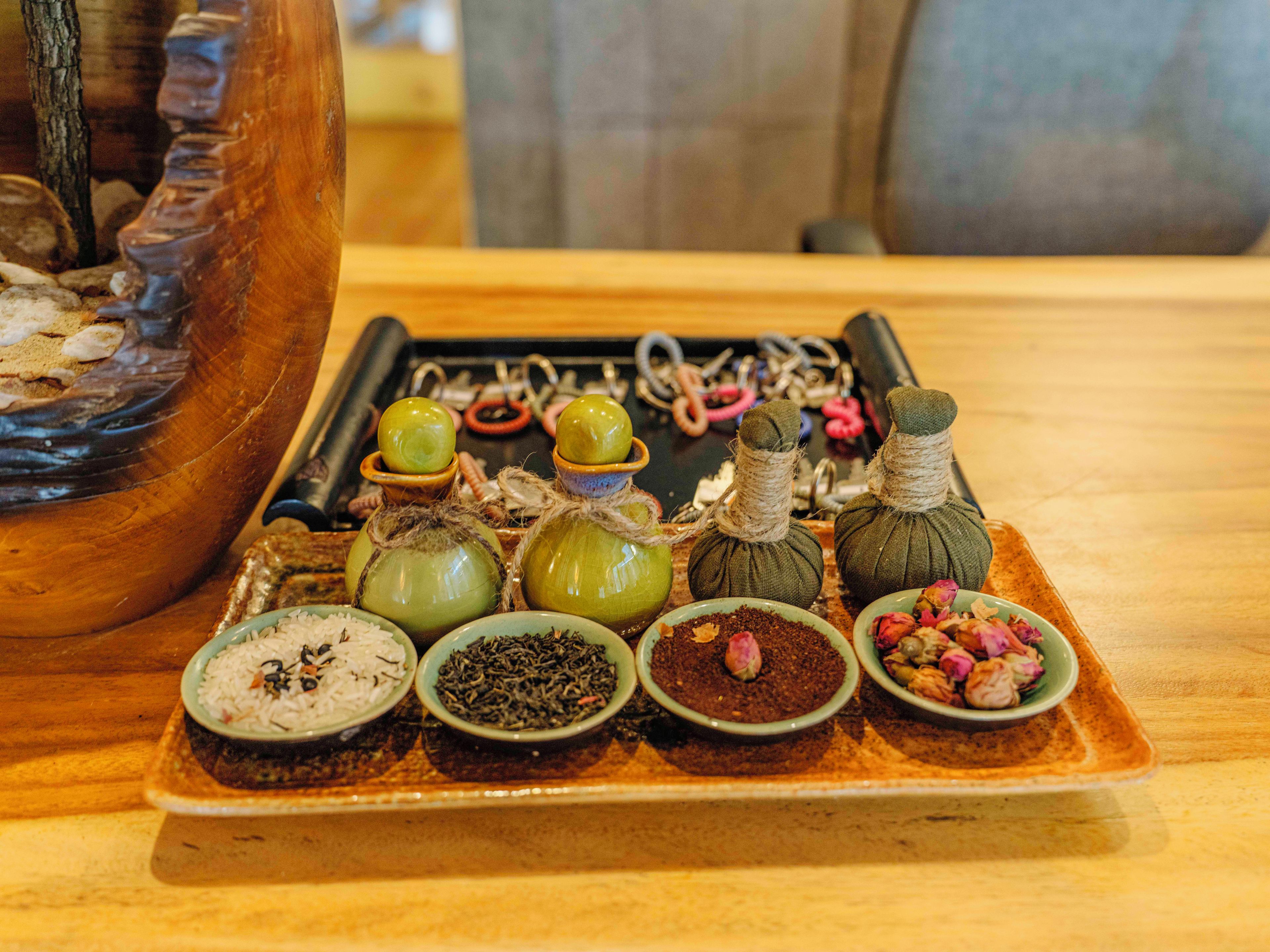 A tray with various food items and a decorative wooden object.