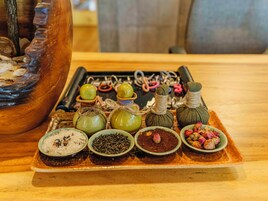 A tray with various food items and a decorative wooden object.