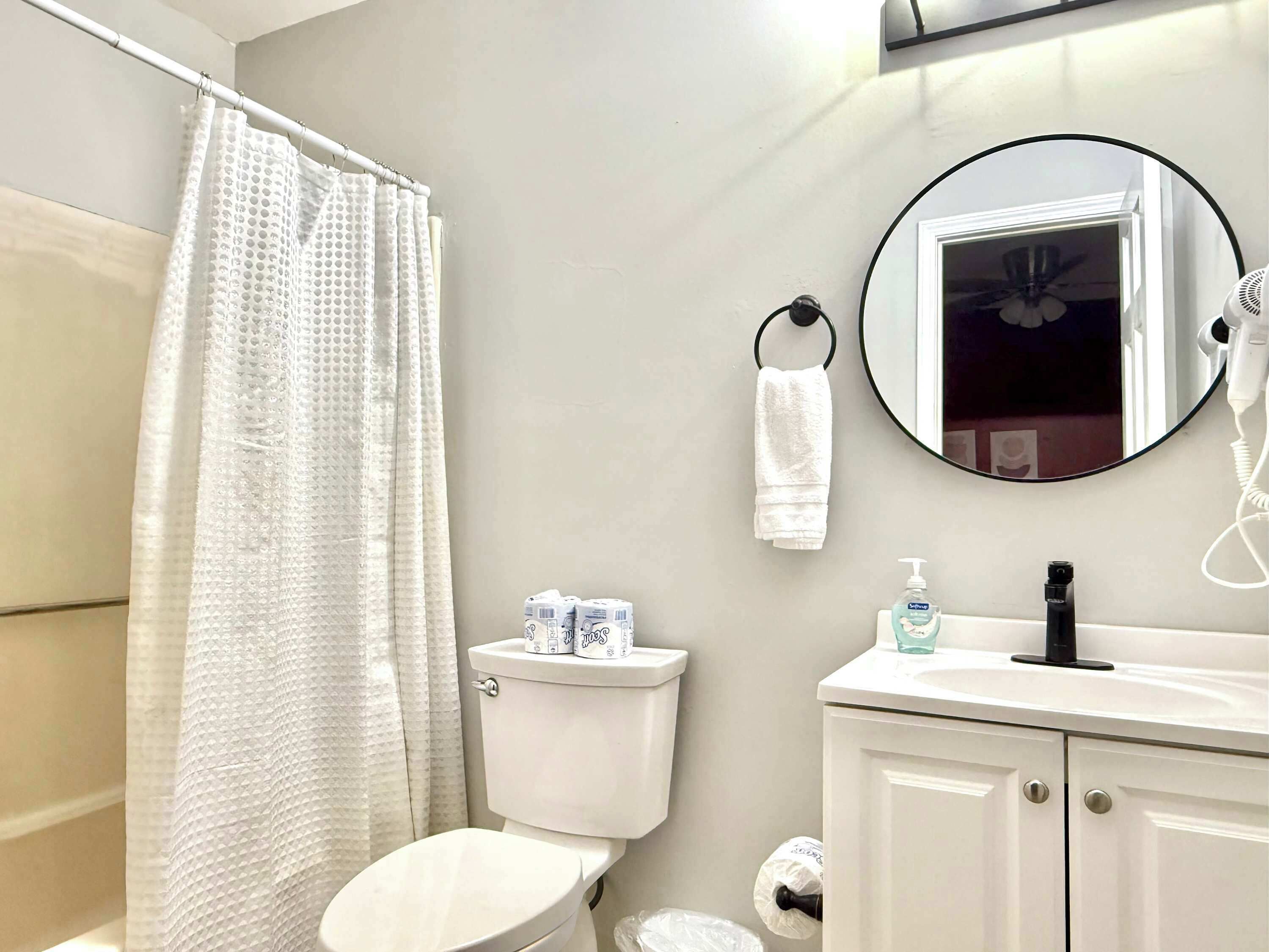 Shower, hair dryer, towels