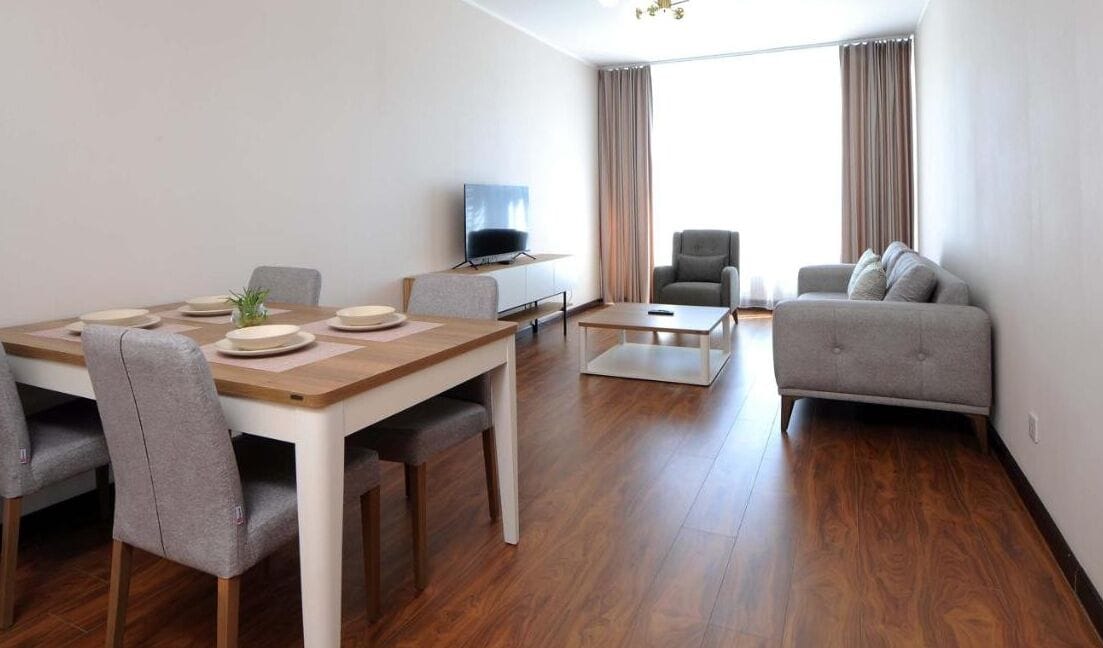 1 king bed & 2 twin bed rooms apartment with 1 bathroom | Living area | 42-inch LED TV with cable channels