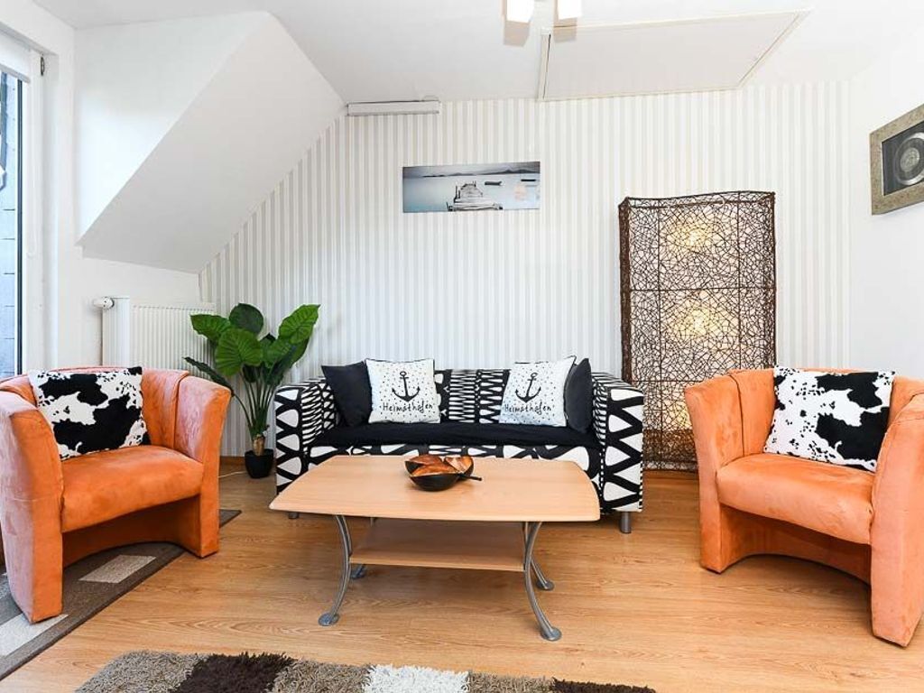 Wohnzimmer mit integriertem Küchenbereich