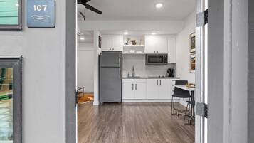 Fridge, microwave, coffee/tea maker, cookware/dishes/utensils