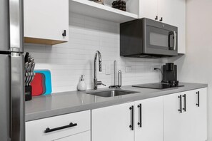 Fridge, microwave, stovetop, coffee/tea maker