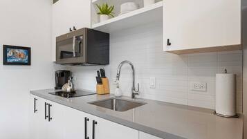 Fridge, microwave, stovetop, coffee/tea maker