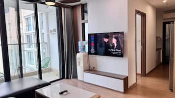Standard Apartment, 3 Bedrooms | Living area | 65-inch flat-screen TV with satellite channels, fireplace