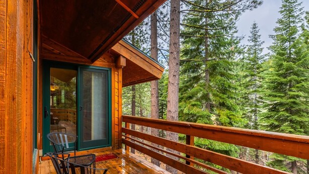 A wooden cabin with a balcony overlooking a forest. - Northstar Home w/Rec Center Access (Truckee)