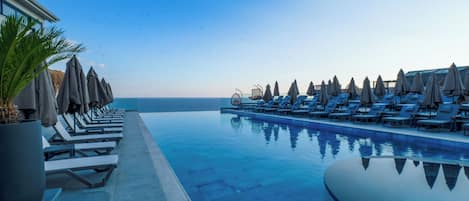 Outdoor pool, open 8:00 AM to 6:00 PM, cabanas (surcharge)
